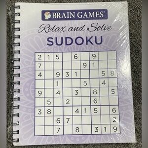 Purple and White Sudoku Puzzle Book for